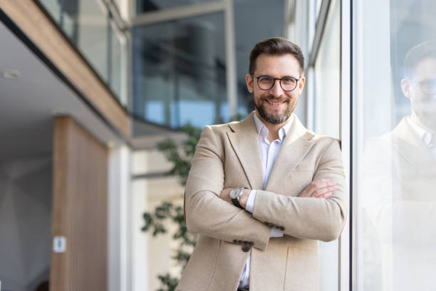 istock Charming Businessman with Armes crossed Smiling in Office 2199819651
