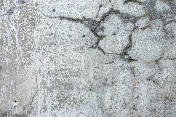 istock Grey retro cement crack with sand and stone good for decorative design element, vintage surface of architecture urban. 2199828017