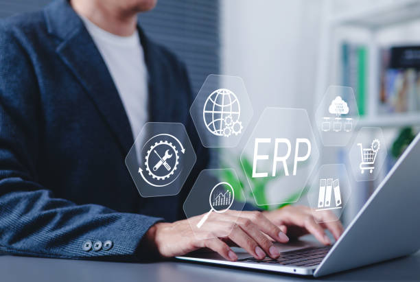 istock ERP Enterprise Resource Planning system concept. Businessman using laptop with digital interface ERP (Enterprise Resource Planning) icons, business automation, data integration, workflow management, 2199830289