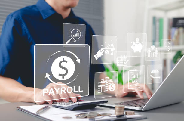 istock Payroll management and financial planning concept. Businessman processes payroll, salary management, financial planning, employee compensation, budgeting, taxes, and accounting in business operations. 2199830290