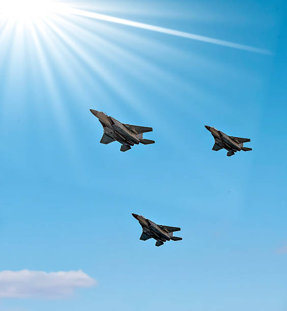 istock Group of modern military jet fighters fly over sky 2199833985