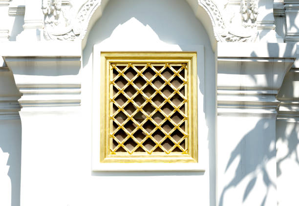 Shot in color detail on the facade of this historic building representing some character, animal or flower. Set at Bangkok, Thailand, Asia