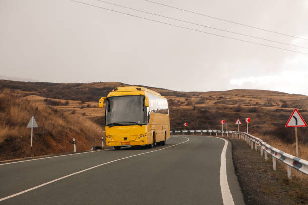 istock car driving on the road in norway 2199837201
