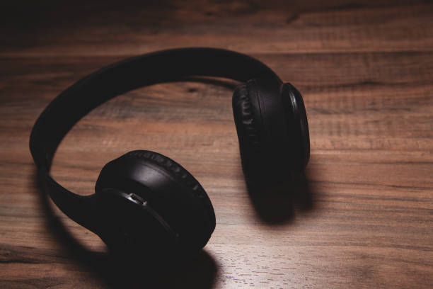istock headphones on wooden background 2199837202