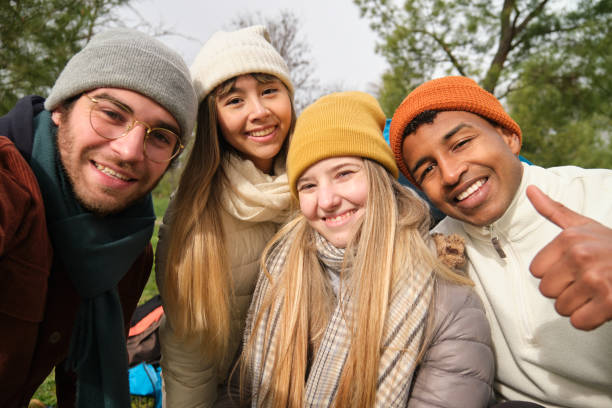istock Group of young adults taking a selfie outdoors while hiking 2199840228