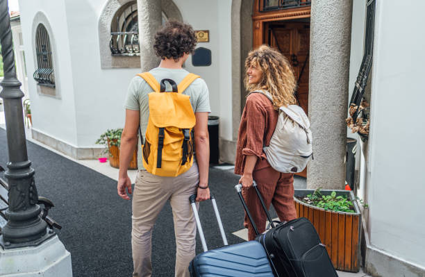 istock Young couple arriving at the hotel 2199841588