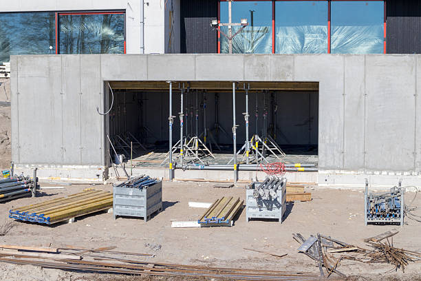 istock .construction site with concrete walls, scaffolding and various building materials. 2199842928