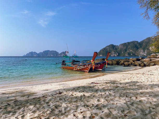 istock Sailing with longboat near Long beach in Koh Phi Phi island, Thailand 2199844041