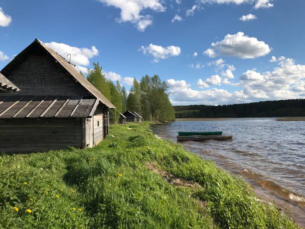istock House with a boat on the river bank 2199850348