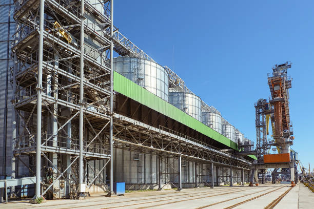 istock Sea port storage facility for bulk cargo with grain loading crane in a terminal 2199850855