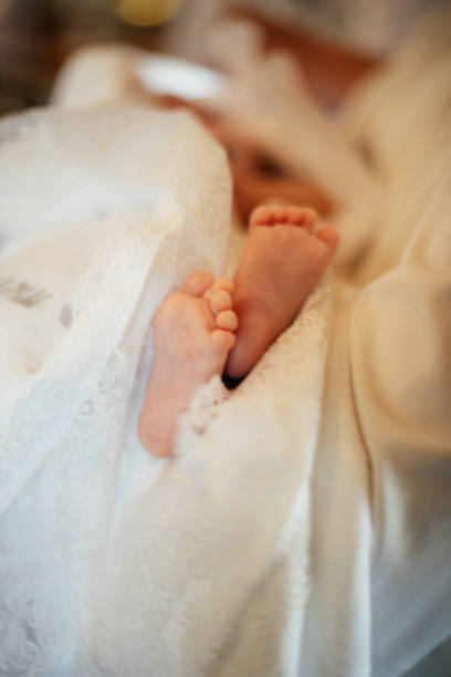istock baptism of a child 2199858019