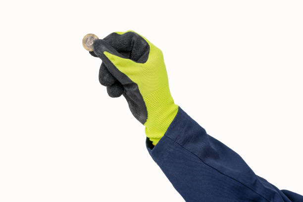 istock handyman putting an euro coin 2199860015