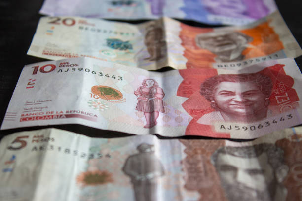istock Colombian money on black surface 2199860968