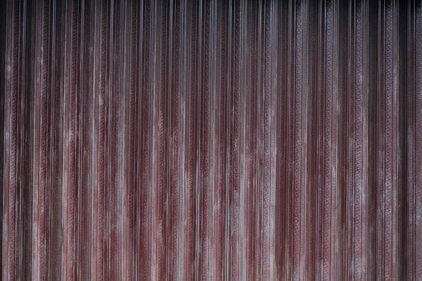 the rusted and faded iron door is closed