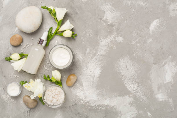 istock Flat lay with spa products and flowers on concrete background 2199863780