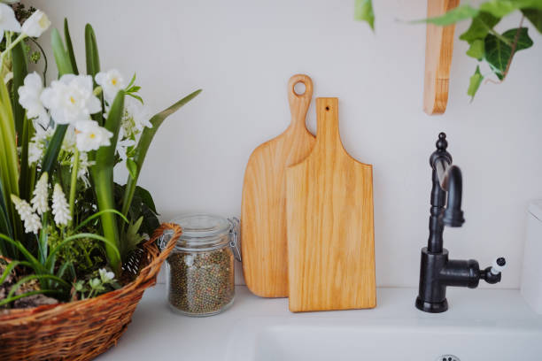 istock Wooden cutting boards and green plants in a kitchen setting 2199869633