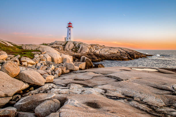 istock Pegg's Cove Lighthouse in Nova Scotia during Sunset 2199876543