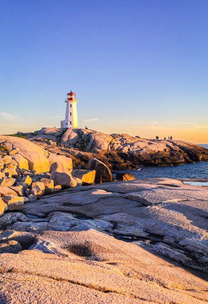 istock Pegg's Cove Lighthouse in Nova Scotia during Sunset 2199876550