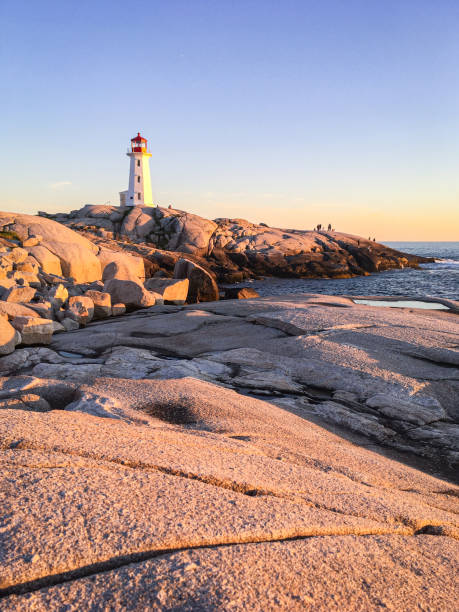 istock Pegg's Cove Lighthouse in Nova Scotia during Sunset 2199876552