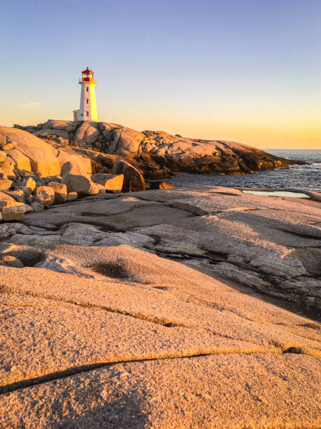 istock Pegg's Cove Lighthouse in Nova Scotia during Sunset 2199876566