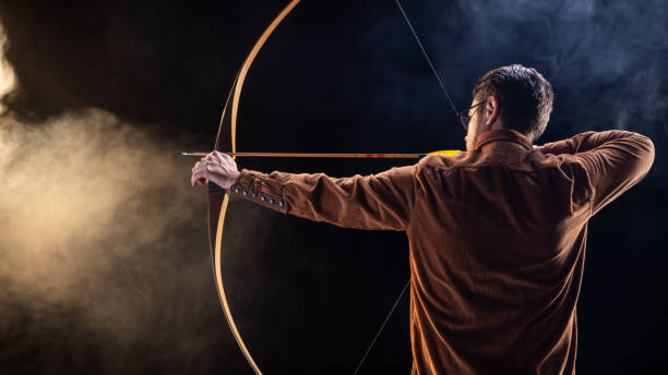 istock Focused Young Caucasian Male Archer in Action 2199877168