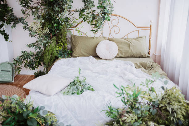 istock Cozy bedroom adorned with lush greenery for a tranquil atmosphere 2199877413