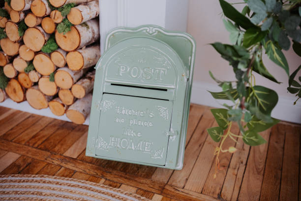 Vintage post box set against a rustic wood backdrop in cozy interior space