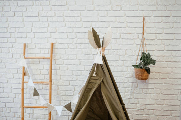 istock Cozy indoor play area with a tent and decorative elements for children 2199877505