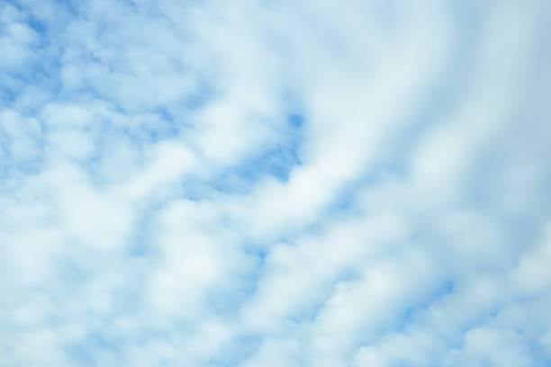 Blue sky with cloudy haze. Celestial atmospheric background.