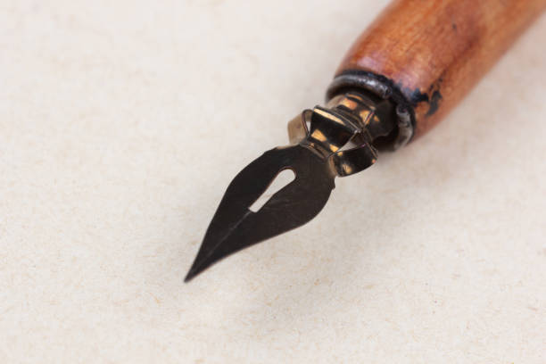 Fountain pen on an antique textured paper background.