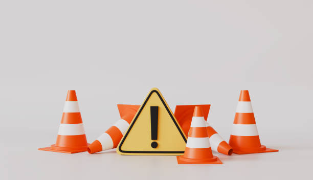 istock Red traffic cones with triangle warning symbol icon isolated on pastel color background, accident prevention concept 2199884101