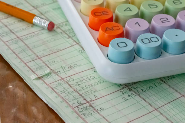 Tax Time, a calculator, a pencil and a sheet with numbers. The numbers are calculated and cataloged.