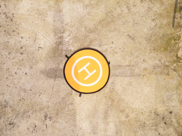 istock A round drone pad with orange color with cement floor background 2199888938