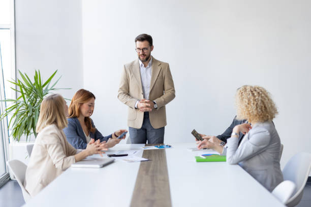 istock Businessman Leading Discussion with Engaged Audience 2199891295