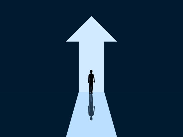 istock Development, Success, Opportunity ,Businessman Walking Through an Arrow-Shaped Door Growing 2199899569