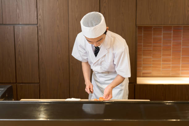 istock Japanese chef cooking in the kitchen 2199902498