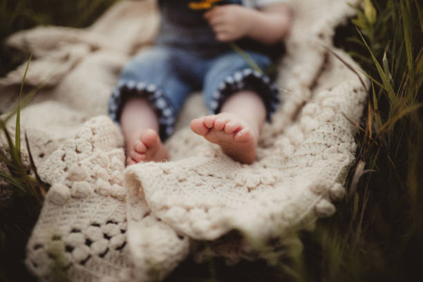 Bare feet and toes of little girl outdoors