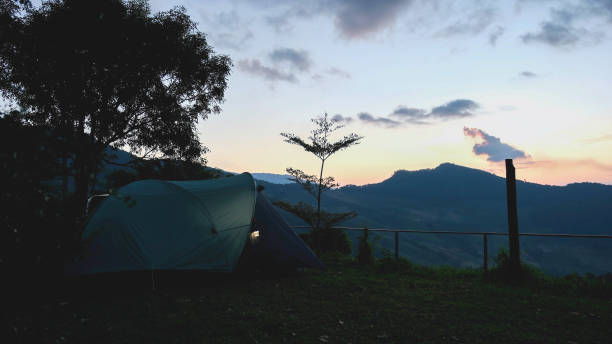 istock A tent with mountain view and evening sky 2199907802