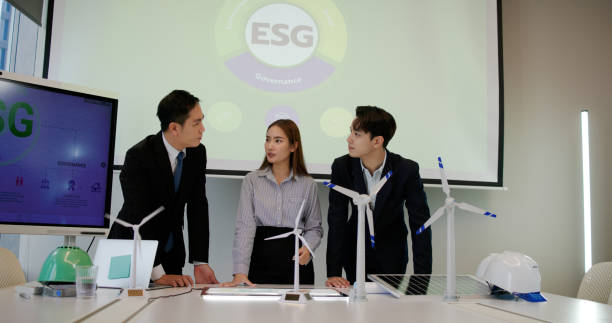 istock The engineering team brainstorms meetings in the factory office. Presentation on ESG project planning, solar panels, wind turbine power generation, and environmentally sustainable energy efficiency. Industrial business 2199909627