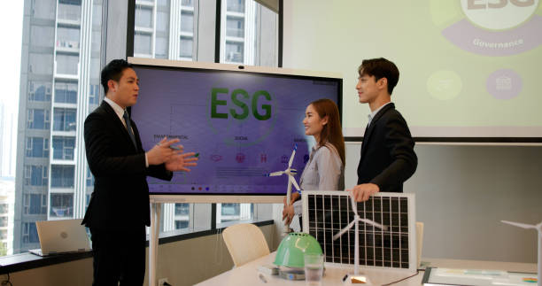 istock The engineering team brainstorms meetings in the factory office. Presentation on ESG project planning, solar panels, wind turbine power generation, and environmentally sustainable energy efficiency. Industrial business 2199909645