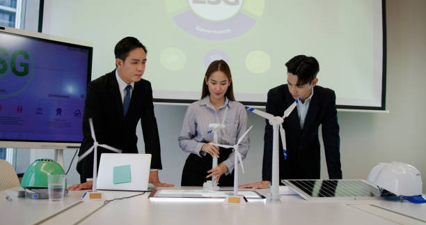 istock The engineering team brainstorms meetings in the factory office. Presentation on ESG project planning, solar panels, wind turbine power generation, and environmentally sustainable energy efficiency. Industrial business 2199909650