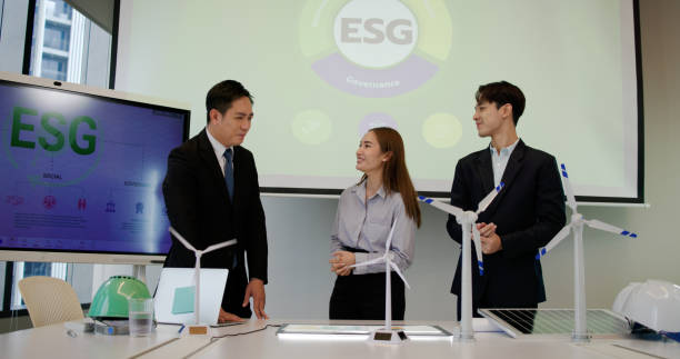 istock The engineering team brainstorms meetings in the factory office. Presentation on ESG project planning, solar panels, wind turbine power generation, and environmentally sustainable energy efficiency. Industrial business 2199909659