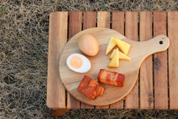 Fried eggs, bacon and toasts isolated on white background