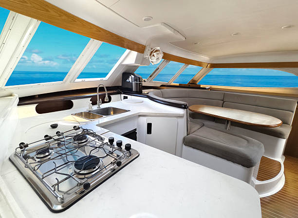 istock A cozy living room and kitchen featuring a stylish curved couch and a table located on sailing boat 2199912386