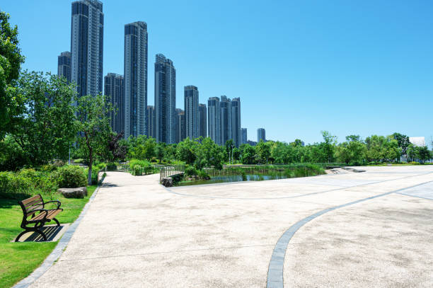 istock Empty square floor with modern urban skyline and sunny blue sky background 2199912800