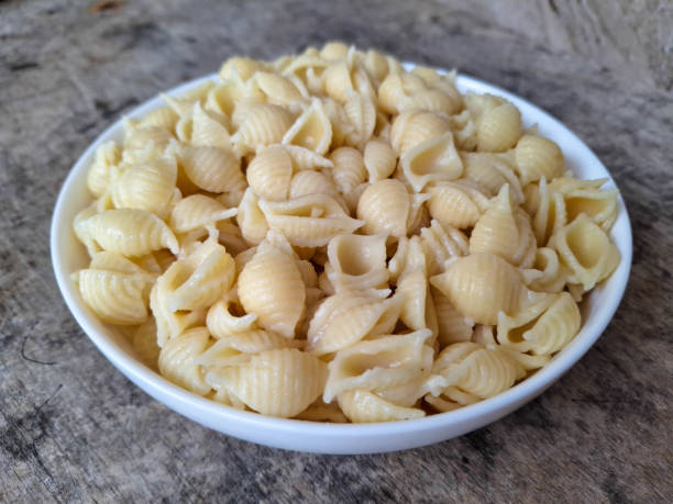 istock Delicious Shell Conchiglie Macaroni Pasta On A Plate. Food Menu. 2199915521