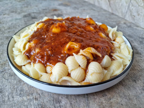 Delicious Shell Conchiglie Macaroni Bolognese On A Plate. Food Menu.