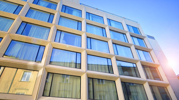 Large glass windows in a modern hotel building.
