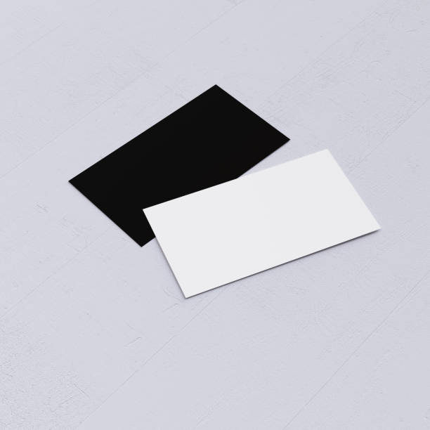 istock Two empty business card mockup on white desk 2199927649