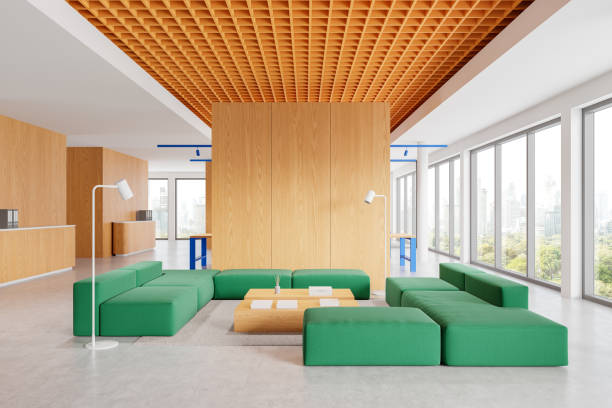 istock Modern open space office interior with green seating area and wooden accents. 3D Rendering 2199927692